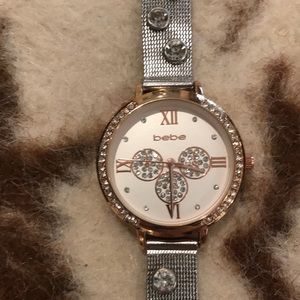 Bebe Watch. Silver and gold colors.